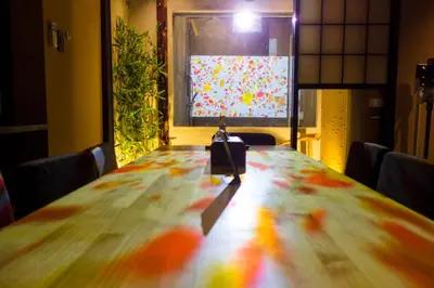 a long wooden table with a camera on top of it at Asakura Ninja House Tokyostoryhotel, Tokyo Skytree in Tokyo