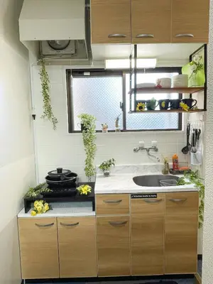 a small kitchen with a sink and a stove at Belmont 202 3min to Station Easy Access Ueno Asakusa Skytree Sleeps 5 in Tokyo