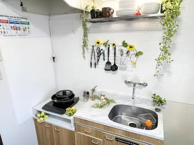 a kitchen with a sink and some plants on the wall at Belmont 203 3min to Station Easy Access Ueno Asakusa Skytree Sleeps 4 in Tokyo