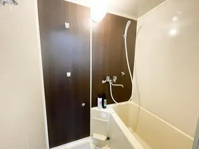 a bathroom with a toilet and a shower with a mirror at Belmont 203 3min to Station Easy Access Ueno Asakusa Skytree Sleeps 4 in Tokyo