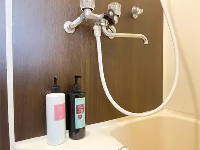 a bathroom sink with a faucet and a bottle of soap at Belmont 203 3min to Station Easy Access Ueno Asakusa Skytree Sleeps 4 in Tokyo