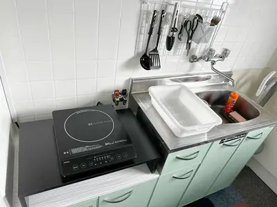 a kitchen counter with a sink and a microwave at Belmont 203 3min to Station Easy Access Ueno Asakusa Skytree Sleeps 4 in Tokyo