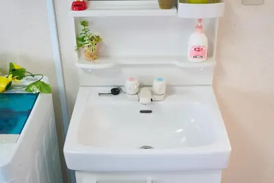a white sink in a bathroom with a shelf at Belmont 301 3min to Station Easy Access Ueno Asakusa Skytree Sleeps 5 in Tokyo