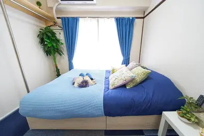 a small bed in a small room with a window at Belmont 301 3min to Station Easy Access Ueno Asakusa Skytree Sleeps 5 in Tokyo