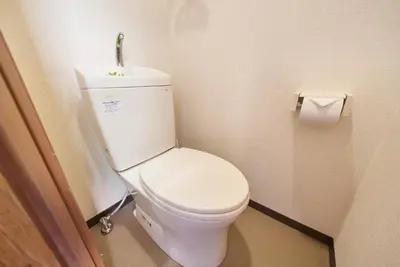 a bathroom with a white toilet with a sink at Belmont 302 3min to Station Easy Access Ueno Asakusa Skytree Sleeps 5 in Tokyo