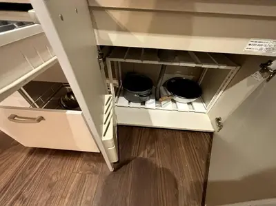 a kitchen cabinet with two pots and pans in it at \u6771\u6d45\u83492\u4e01\u76eeb202 in Tokyo