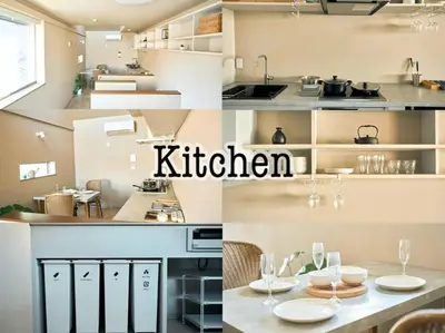 a kitchen with white cabinets and a table with wine glasses at \u6771\u6d45\u83492\u4e01\u76ee\u6238\u5efa in Tokyo