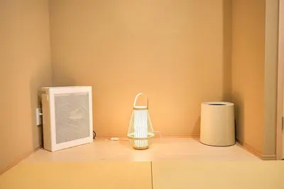 a corner of a room with a heater and a microwave at \u6771\u6d45\u83492\u4e01\u76ee\u6238\u5efa in Tokyo