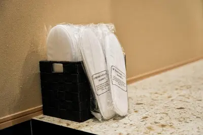 a plastic bag sitting on a counter next to a wall at \u6771\u6d45\u83492\u4e01\u76ee\u6238\u5efa in Tokyo
