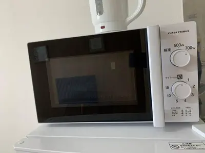 a microwave sitting on top of a counter at Maison Shin Nakano 203 MS23 in Tokyo