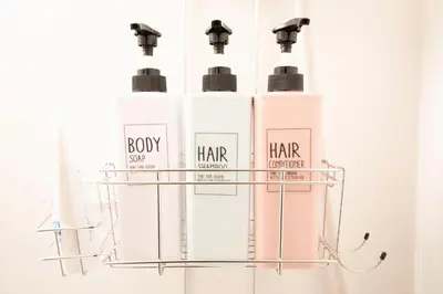 a group of four bottles of hair products on a shelf at Jarudan Building 2F - Vacation STAY 17316 in Tokyo