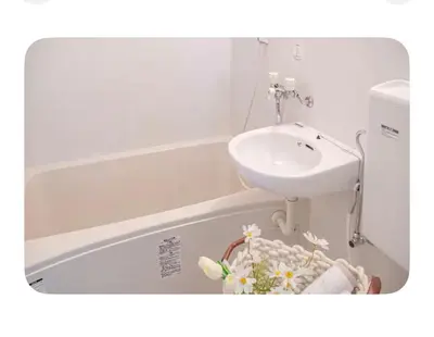 a bathroom with a sink and a bath tub with a sink at Shinjuku 2 stops, 3 people,station walk for 4 mins in Tokyo