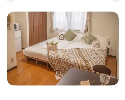 a bedroom with a large bed in a room at Shinjuku 2 stops, 3 people,station walk for 4 mins in Tokyo