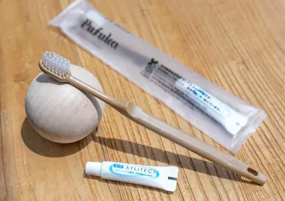 a group of toothbrushes and toothpaste on a table at NEW! Pufuka Oshiage \u3077\u3075\u304b\u62bc\u4e0a in Tokyo