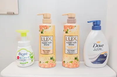 a group of four bottles of cleaning products on a shelf at mori house\u897f\u304c\u4e18 in Tokyo