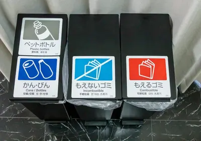 a group of three signs on a shelf at Benir Maison Izumi in Tokyo