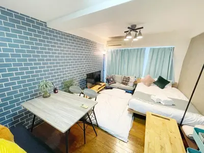 a living room with a couch and a table at LVB Shibuyadogenzaka in Tokyo