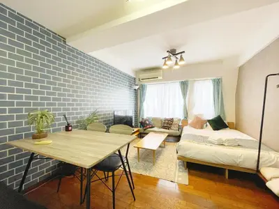 a living room with a table and a couch at LVB Shibuyadogenzaka in Tokyo