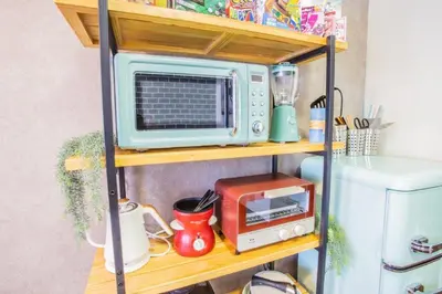 a shelf with a microwave and a toaster oven at LVB Shibuyadogenzaka in Tokyo
