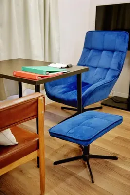 a blue chair sitting next to a table and a blue chair with a table at Green & Orange House - Economic APT in Tokyo Tranquil Block, with Direct Access to Ginza & Akihabara in Tokyo