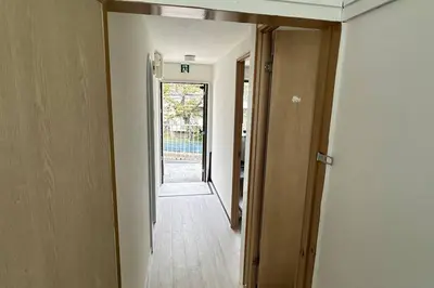 an empty hallway with a door leading to a room at Warmhome-hirai2F in Tokyo