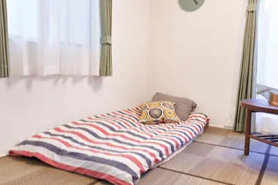 a blanket on the floor in a room at GM3442 Three-story Japanese-style villa in Shinjuku in Tokyo