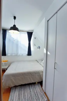 a bedroom with a bed and a window at GM3442 Three-story Japanese-style villa in Shinjuku in Tokyo
