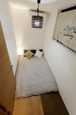 a small room with a bed in a wall at GM3442 Three-story Japanese-style villa in Shinjuku in Tokyo