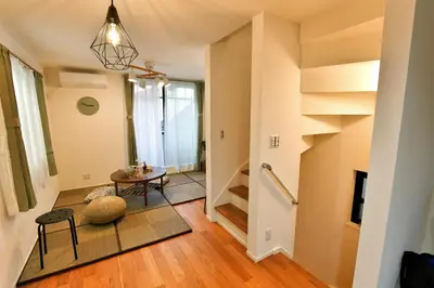 a hallway of a home with a staircase and a table at GM3442 Three-story Japanese-style villa in Shinjuku in Tokyo