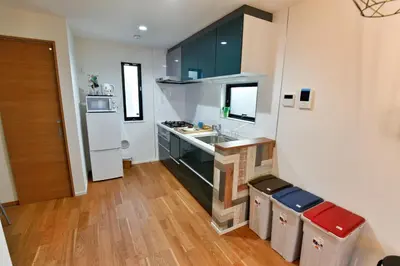 a small kitchen with a sink and a refrigerator at GM3442 Three-story Japanese-style villa in Shinjuku in Tokyo