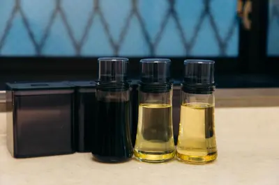 two bottles of oil sitting on top of a table at Garfield home Shinjuku in Tokyo