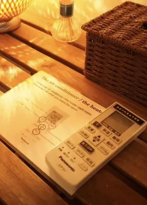 a remote control sitting on a table next to a basket at Ginza 201,Tsukiji 3 mins,Tsukiji Market in Tokyo