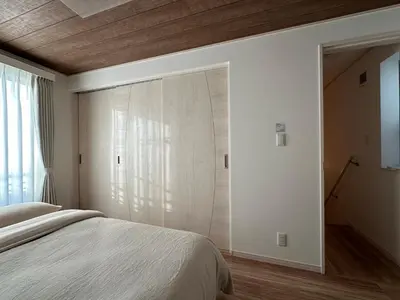 a bedroom with a bed and a sliding door at Wasabi Box House - Ikebukuro Area in Tokyo