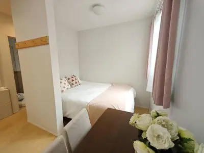 a small room with a bed and a table at Nerima house NR0250 in Tokyo