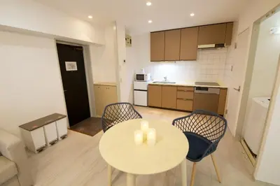 a kitchen with a table and chairs in a room at Palais Grace Room 301 - Vacation STAY 56621v in Tokyo