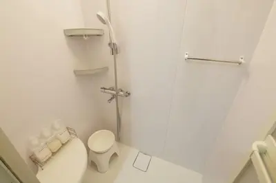 a white bathroom with a toilet and a shower at Palais Grace Room 301 - Vacation STAY 56621v in Tokyo