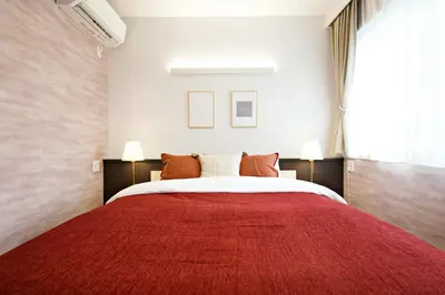 a bedroom with a large bed with a red blanket at The Masters Stay Room 302 - Vacation STAY 06093v in Tokyo