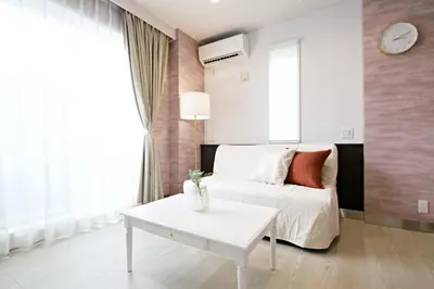 a bedroom with a white bed and a table at The Masters Stay Room 302 - Vacation STAY 06093v in Tokyo