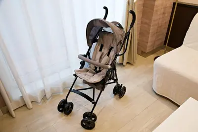 a baby stroller sitting in a room next to a bed at The Masters Stay Room 302 - Vacation STAY 06093v in Tokyo