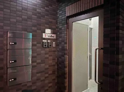 a restroom with a tittle sign on a brick wall at yuga hotel tokiwadai in Tokyo