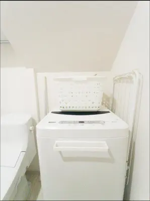 a white refrigerator in a kitchen with a ceiling at \u30b9\u30ab\u30a4\u30c4\u30ea\u30fc\u30d0\u30b1\u30fc\u30b7\u30e7\u30f3 in Tokyo