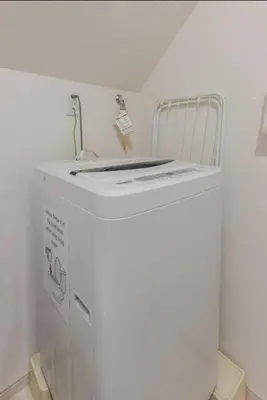 a white washer and dryer in a room at \u30b9\u30ab\u30a4\u30c4\u30ea\u30fc\u30d0\u30b1\u30fc\u30b7\u30e7\u30f3 in Tokyo