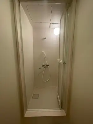 a bathroom with a shower with a glass door at Tokyo Shibya 88 Shared House in Tokyo