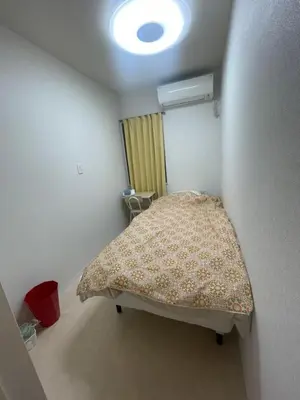 a small bedroom with a bed in a room at Tokyo Shibya 88 Shared House in Tokyo