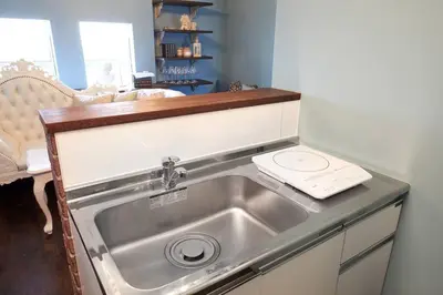 a kitchen sink with a phone on top of it at Spacious 80sqm Apt near Shibuya Crossing, 8 min walk to Shibuya Station in Tokyo