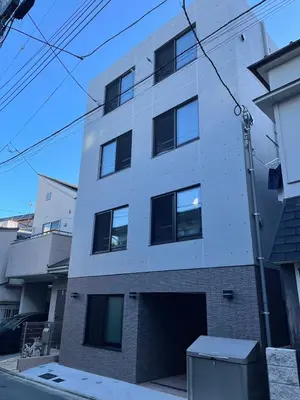 a white building with a lot of windows at COMMA HOUSE Otsuka 102 in Tokyo