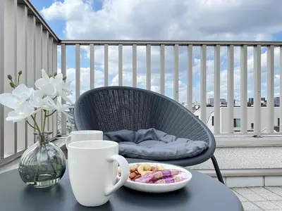 a table with a bowl of food on a balcony at Second Home KANAMECHO in Tokyo