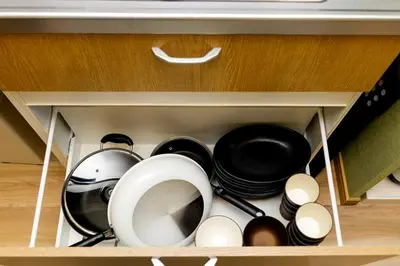 a drawer filled with pots and pans in a kitchen at unito \u9752\u7825 in Tokyo