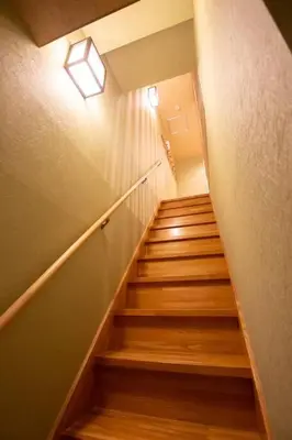 a stairway with a light and a stair case at unito \u9752\u7825 in Tokyo