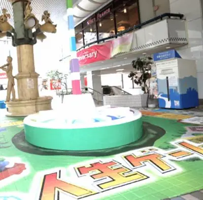 a large building with a floor with a clock on it at unito \u9752\u7825 in Tokyo